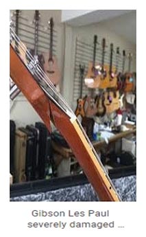 Damaged Gibson Les Paul guitar